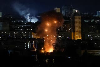 An explosion of a drone is seen during a Russian drone and missile strike